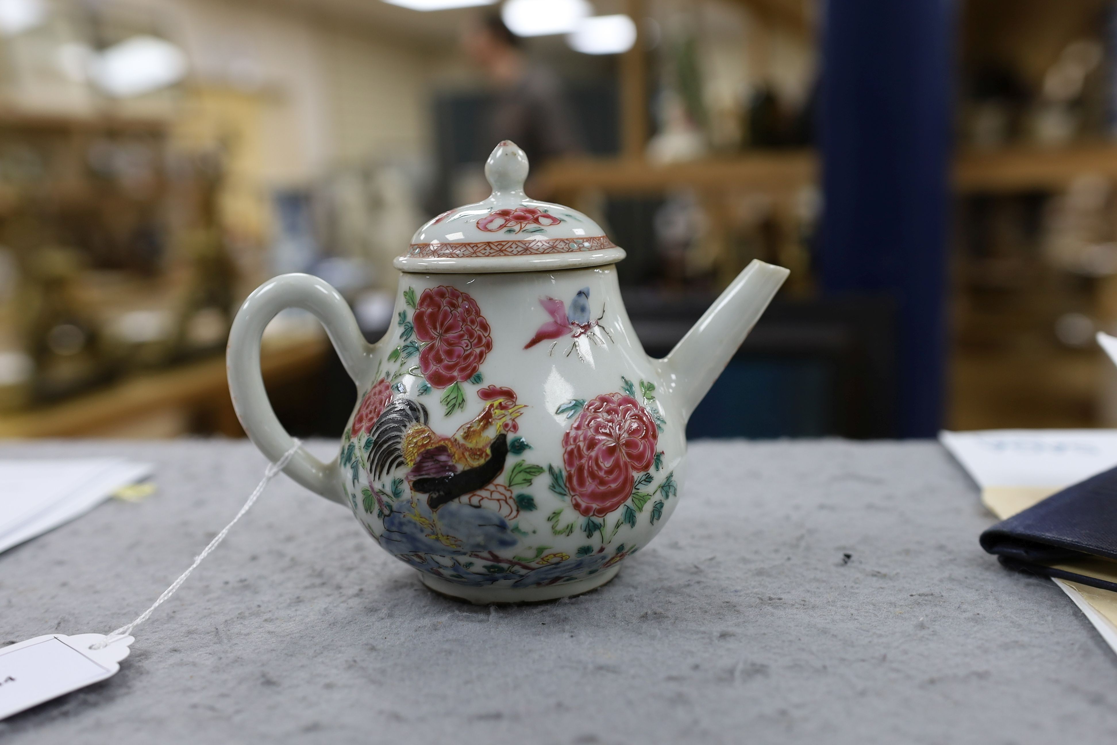 A Chinese famille rose ‘cockerel’ teapot, Yongzheng period, 12 cms high, 11.5cm high